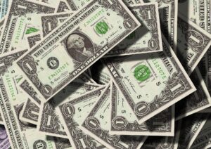 large pile of one dollar bills myths about money